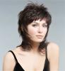 Fashionable women's haircut, which returns a woman in adolescence. It fits all