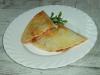 Wheat tortilla stuffed with spicy meat and onion