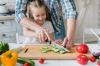 Little helper: how to teach a child to carelessly squirm with a kitchen knife