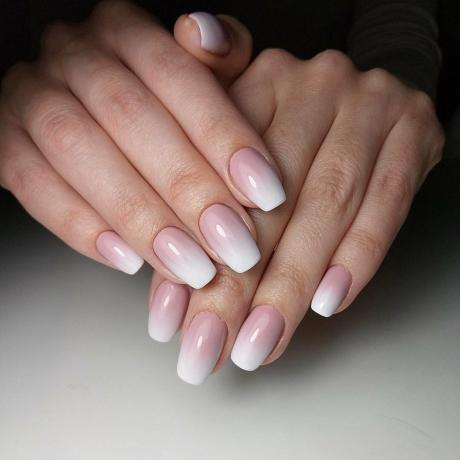 Ombre from flesh pink and white, a smooth transition to the tips of the nails.