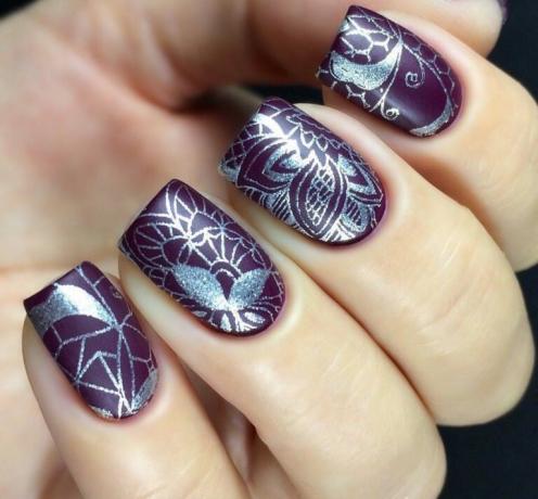 Dark base and top silver patterns made using stamping.