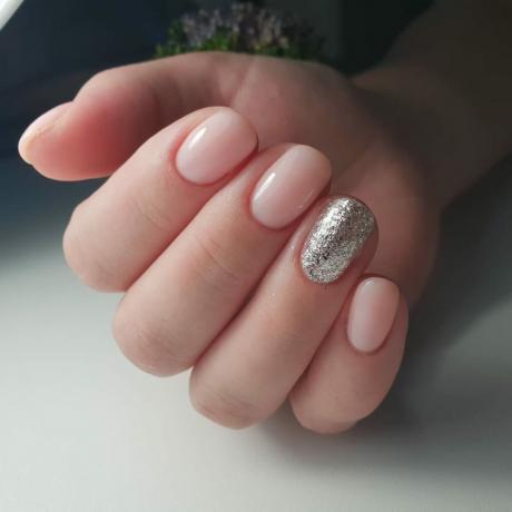 Manicure in natural tones, decorated with silver.