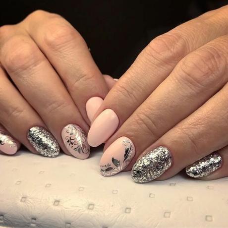 Silver patterns and delicate pink polish.