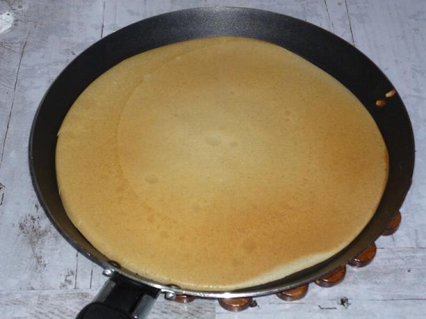 Ready pancake in a frying pan